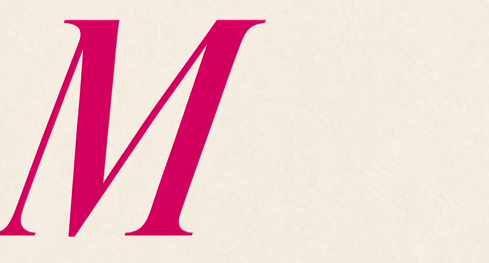 Large pink M with a subtle reflected edge on warm ivory paper